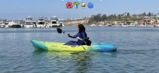 A sister kayaking in Newport Harbor